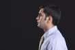 © IndiaPix - Profile shot of businessman against black background