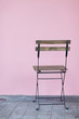 vintage chair with pink wall
