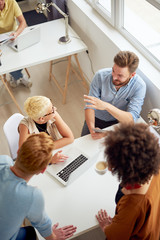 Multi ethnic team having meeting and presentation at modern office