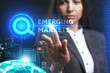 © photon_photo - The concept of business, technology, the Internet and the network. A young entrepreneur working on a virtual screen of the future and sees the inscription: Emerging markets
