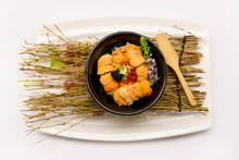 Uni Don (Uni On Rice) In Black Bowl On White Plate And White Background