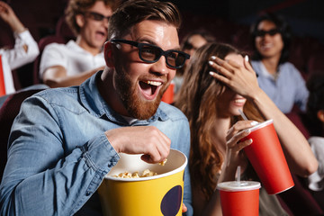 Poster - Laughing friends sitting in cinema watch film