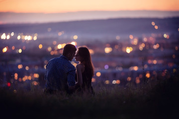 lovers man and girl against background night city, night starry sky and horizon. concept date valent