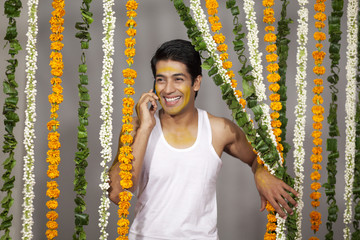 Wall Mural - Indian groom talking on a mobile phone 