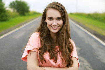 Wall Mural - Closeup portrait of a happy young woman smiling