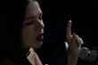© Raman - Beautiful girl In Recording Studio with microphone