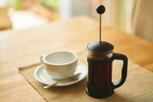 A Fresh Brew Of Coffee In A Cafetiere On A Breakfast Table Early In The Morning.