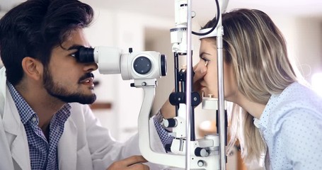 Poster - optometrist checking patient eyesight and vision correction