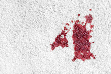 Spot Of Red Wine On White Carpet