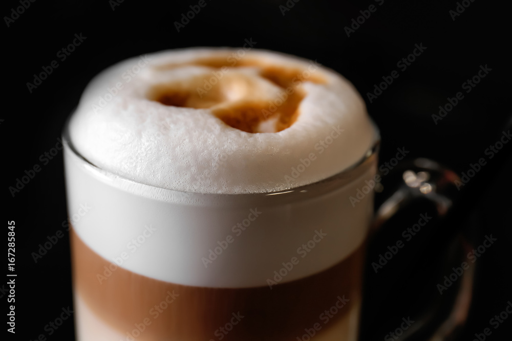 Hot coffee latte in glass, close up