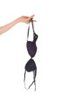 © 80Feierabend - Woman's hand holding a black bra