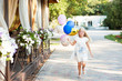Little beautiful girl playing with balloons