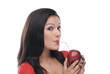 © IndiaPix - Woman sipping juice from an apple