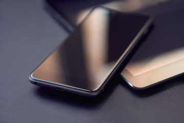 file types: all (11) сloseup the phone on the tablet on the dark desktop. the screen shows the refle