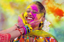 Portrait Of  Young Indian Woman Celebrating Holi Color Festival