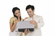 © IndiaPix - South Indian couple with a laptop