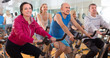 © caftor - older people do sports on exercise bikes