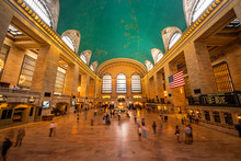 Inside View Of The Main Hall Of Grand Central Terminal Station With Many Peoples In Motion. Picture Of The Big Main Concourse Of The Historic Railroad Station.