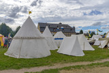 Fototapeta  - White tents on a medieval festival. Knights' Camp.