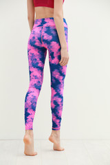 Wall Mural - Young woman in beautiful yoga pants on light wall background