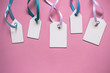 Blank paper price sale tags On pink background