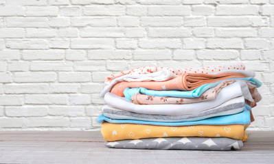 Wall Mural - Stack of cotton colorful clothes empty space background.