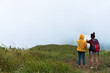 © Joeahead - Duo female hiker with backpack reading and searching map while way of mountain was covered by heavy mist.