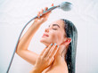© Subbotina Anna - Beauty sexy model girl taking shower and washing her long black hair