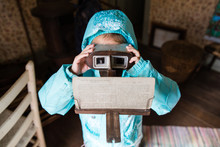 Young Girl Looking Through Vintage  Viewfinder