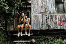 Women Embracing In Wrecked Cabin