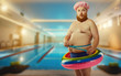© Studio Romantic - Funny man in inflatable circle at the pool