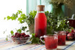 © ChaoShu Li/Stocksy - fresh cranberry juice at the table