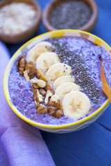 Wall Mural - Smoothie bowl with blueberries, nuts , bananas and chia seeds, healthy vegan breakfast