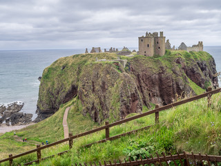 Wall Mural - Dunnottar scottisch medieval fortress or castle. Highlands of Scotland Uk Europe.