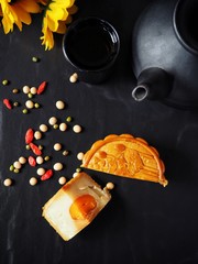 Wall Mural - Festival moon cake with hot tea on black background