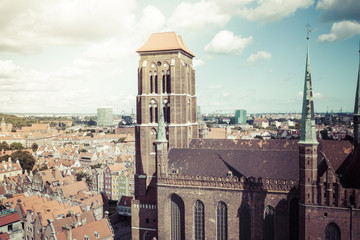 Wall Mural - Cityscape aerial view on the old town with saint Marys church on the sunset in Gdansk, Poland