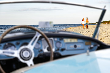 retro car on beach 