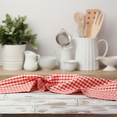 Wall Mural - Empty wooden table with red checked tablecloth