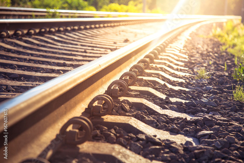 Fotografía Rails and railway going into the distance. Sunny background.