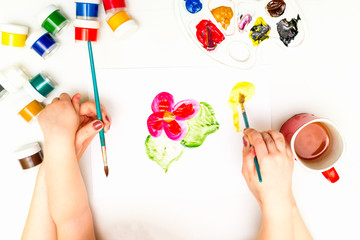 Wall Mural - Child's hands painting a flower