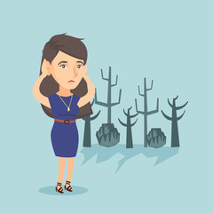 Poster - Young caucasian disappointed woman scratching head while standing in a dead forest caused by global warming or wildfire