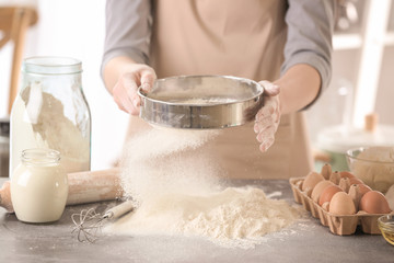 Canvas Print - Female chef making dough in kitchen