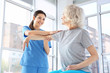 © Africa Studio - Physiotherapist working with elderly patient in clinic