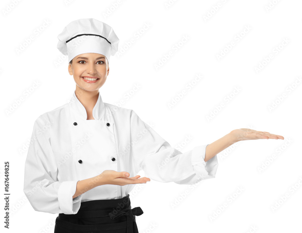 Young female chef on white background