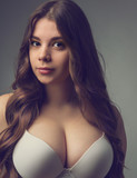 Young Girl With Big Breasts Posing In A Bra Stock Photo, Picture and  Royalty Free Image. Image 83829173.