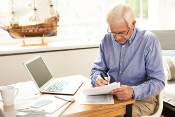 Senior Man Filing Tax Report