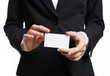 © galaganov - Businesswoman showing and handing a blank business card. Business woman in black suit Isolated on white background.