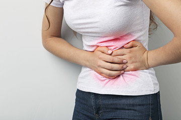 Wall Mural - Woman having stomach ache