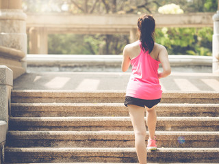 Wall Mural - Woman fitness outdoor concept, young asian beautiful woman/sport girl running walking at outdoor park with fresh, relax, happy feeling.