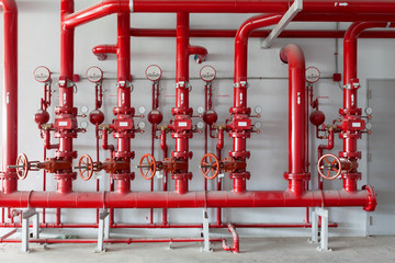 Red water pipe valve,pipe for water piping system control in industrial building.